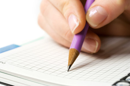 Female hand writing.