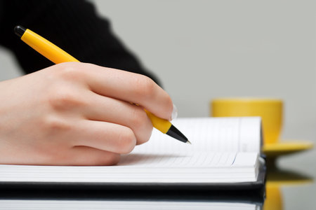 Businesswoman writing.