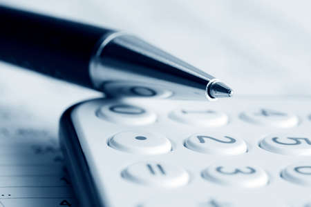 Ballpoint pen on the calculator.の写真素材