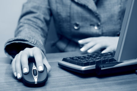 Female hands typing on keyboard.の写真素材