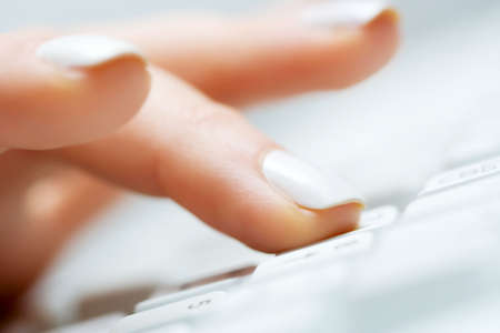 Female hand typing.の写真素材