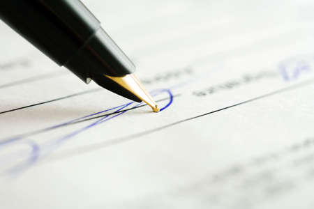 Fountain pen and signing the contract.の写真素材