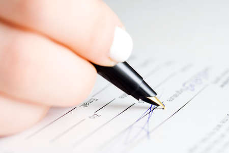 Fountain pen and signing the contract.の写真素材