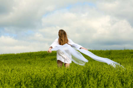 Happy young woman relaxing on nature.の写真素材