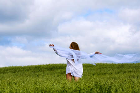 Happy young woman relaxing on nature.の写真素材
