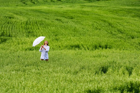Happy young woman relaxing on nature.の写真素材
