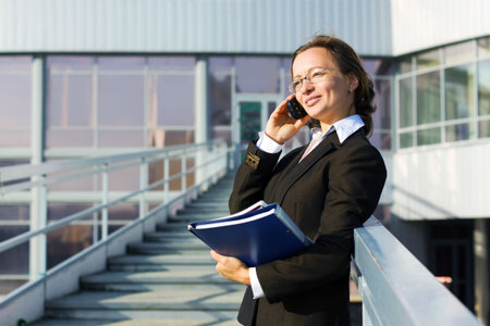 Happy businesswoman on the phone.