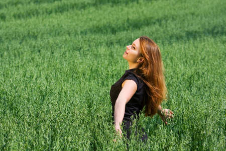 Happy young woman relaxing on nature.の写真素材