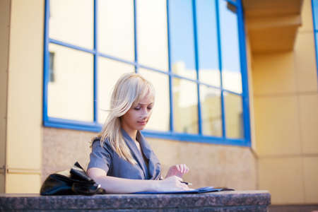 Young businesswoman working with a financial reports.の写真素材
