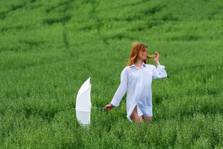 Young woman with umbrella.の写真素材