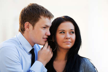 Young couple flirting on a city street.の写真素材