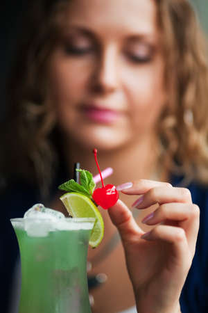 Young woman with a cocktail.の写真素材