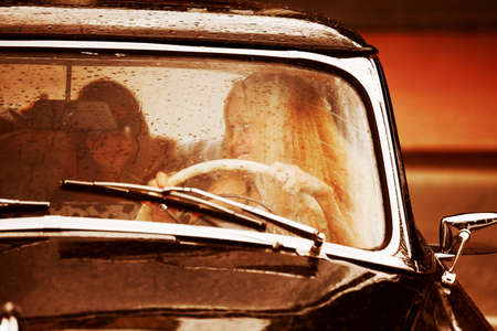 Retro car in the rain.の写真素材