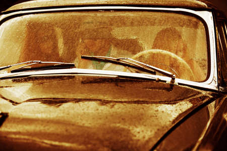 Retro car in the rainの写真素材