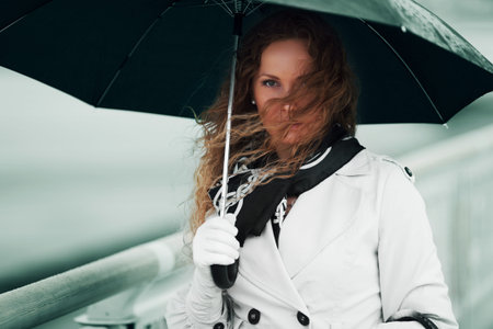 Woman with umbrella in the rain