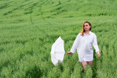 Young woman with umbrellaの写真素材