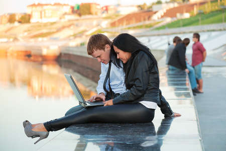 Young couple working on laptopの写真素材