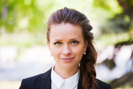 Young businesswoman in a city parkの写真素材