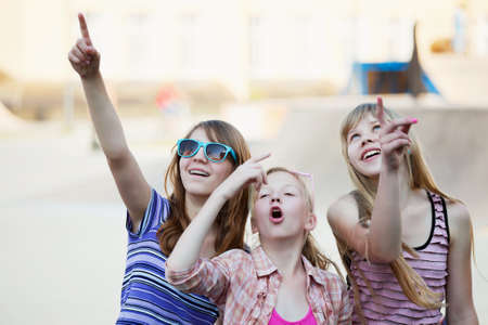 Teenage girls having fun on the playgroundの写真素材