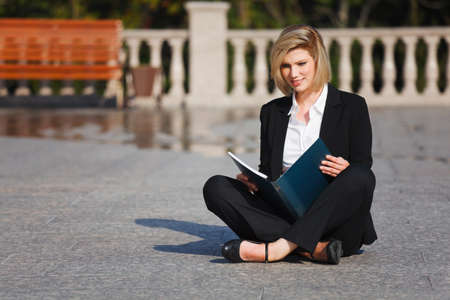 Young businesswoman with a folderの写真素材