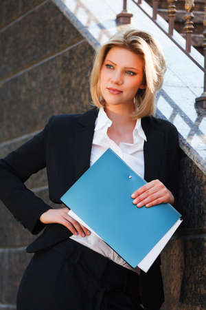 Young businesswoman with a folderの写真素材