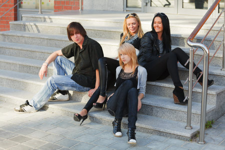 Young people relaxing on the steps