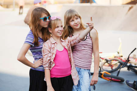 Teenage girls on the playgroundの写真素材