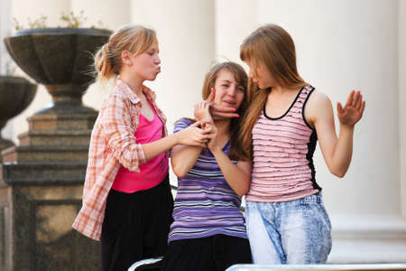 Schoolgirls having fun in a campusの写真素材