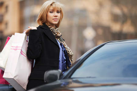Young shopper with a carの写真素材