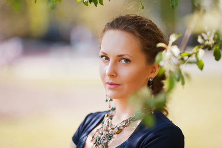 Beautiful woman in a spring gardenの写真素材