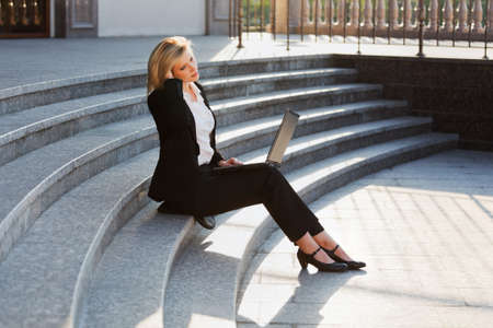 Young businesswoman using laptop の写真素材