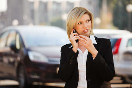 Young businesswoman calling on the phone の写真素材