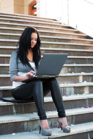 Young woman using laptopの写真素材