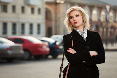 Young woman walking on the streetの写真素材