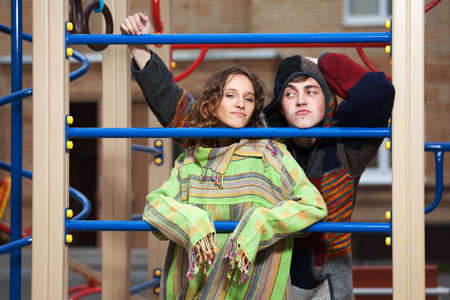Young hippie couple on the playgroundの写真素材