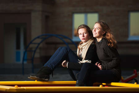 Young girls on the playgroundの写真素材