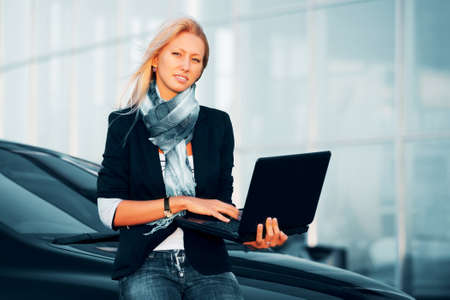 Young businesswoman using laptop の写真素材