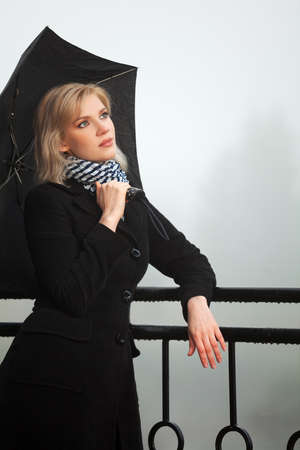 Young woman against a morning foggy landscapeの写真素材