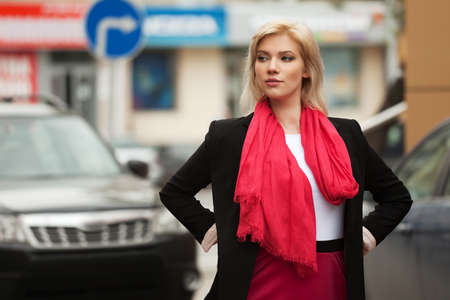 Young woman walking on the city streetの写真素材