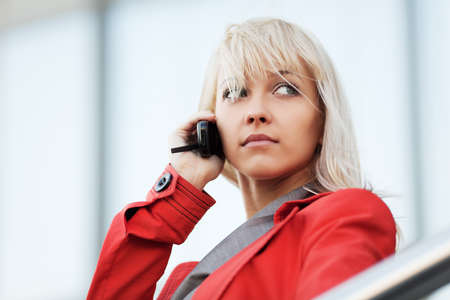Young woman calling on the phone の写真素材