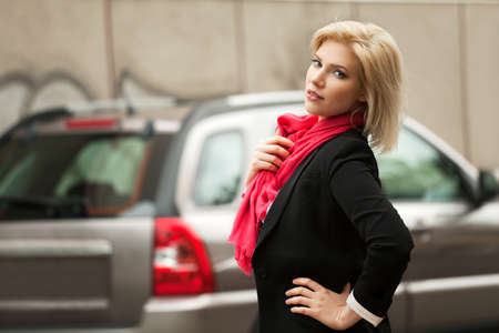 Young woman walking on the city streetの写真素材