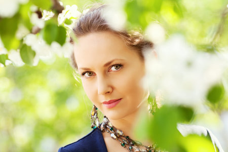 Beautiful woman in a spring garden