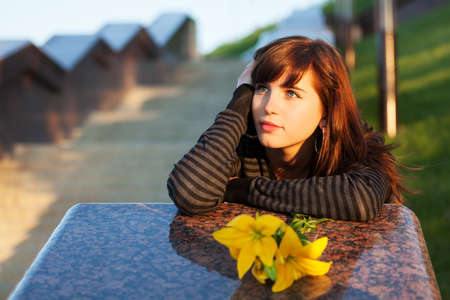 Happy young woman daydreamingの写真素材