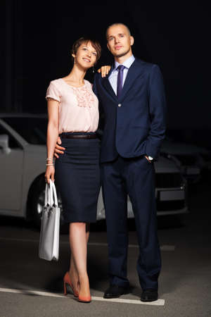 Happy young couple in love on the night city streetの写真素材