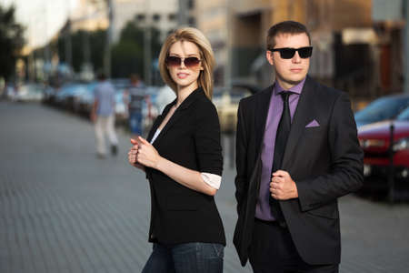 Young business couple on the city streetの写真素材