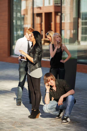Young people calling on the cell phonesの写真素材