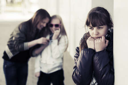 Teenage school girls in conflictの写真素材