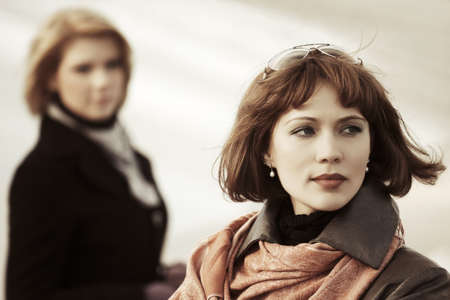 Young fashion women in conflictの写真素材