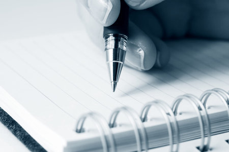 Female hand writing.