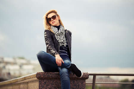 Portrait of happy young fashion woman outdoorの写真素材
